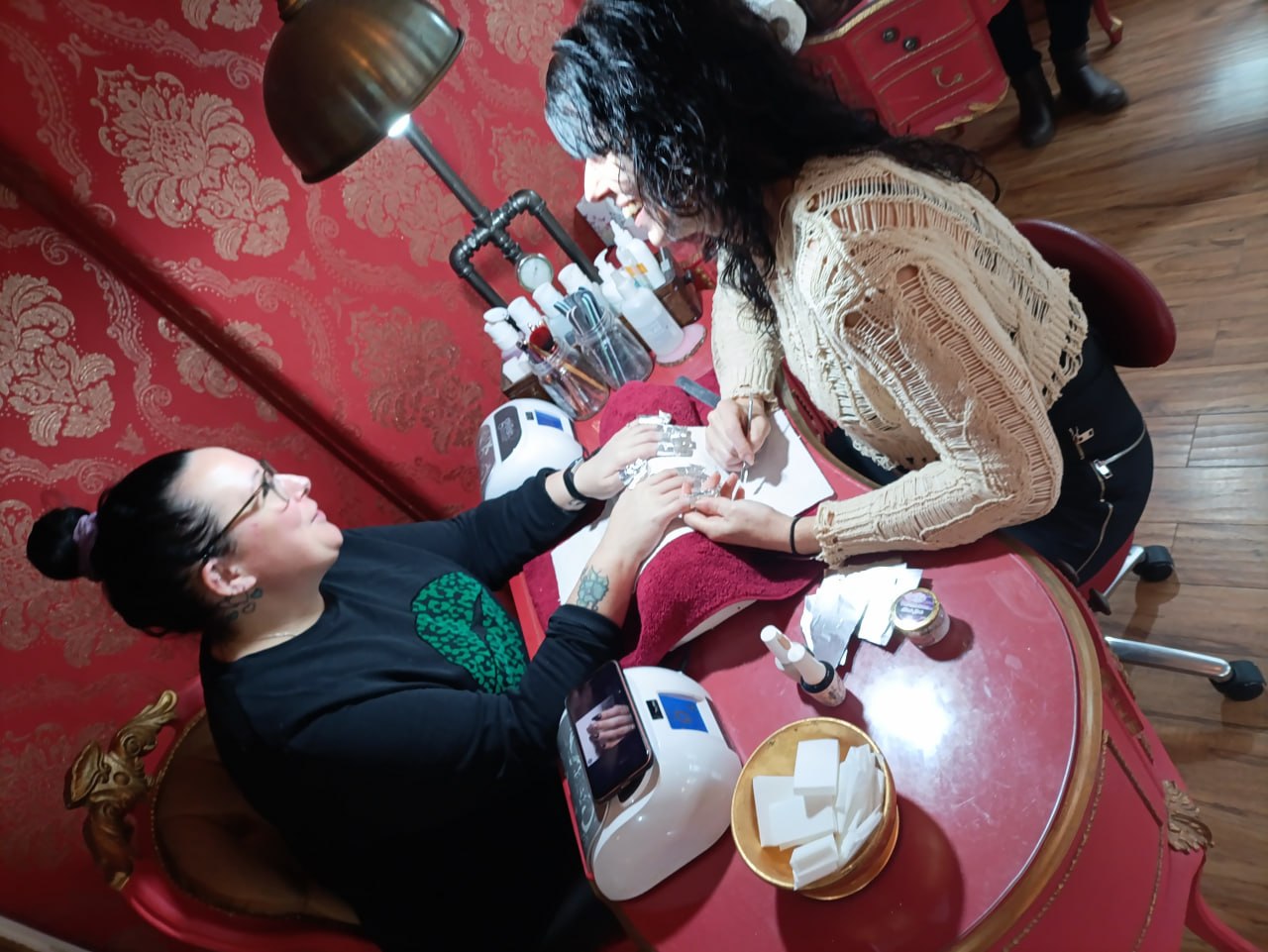 Professional manicure treatment at Gilded Dreams Salon